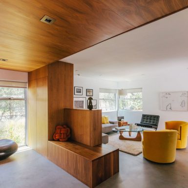 Ranch Redux - Interior view of the entry and living room, with warm wood and mid century modern vibe. Photograph by Tomoko Matsubayashi.