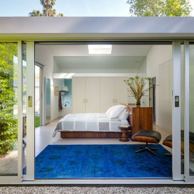 Ranch Redux - Exterior view into modern master bedroom through sliding door. Photograph by Trevor Tondro.